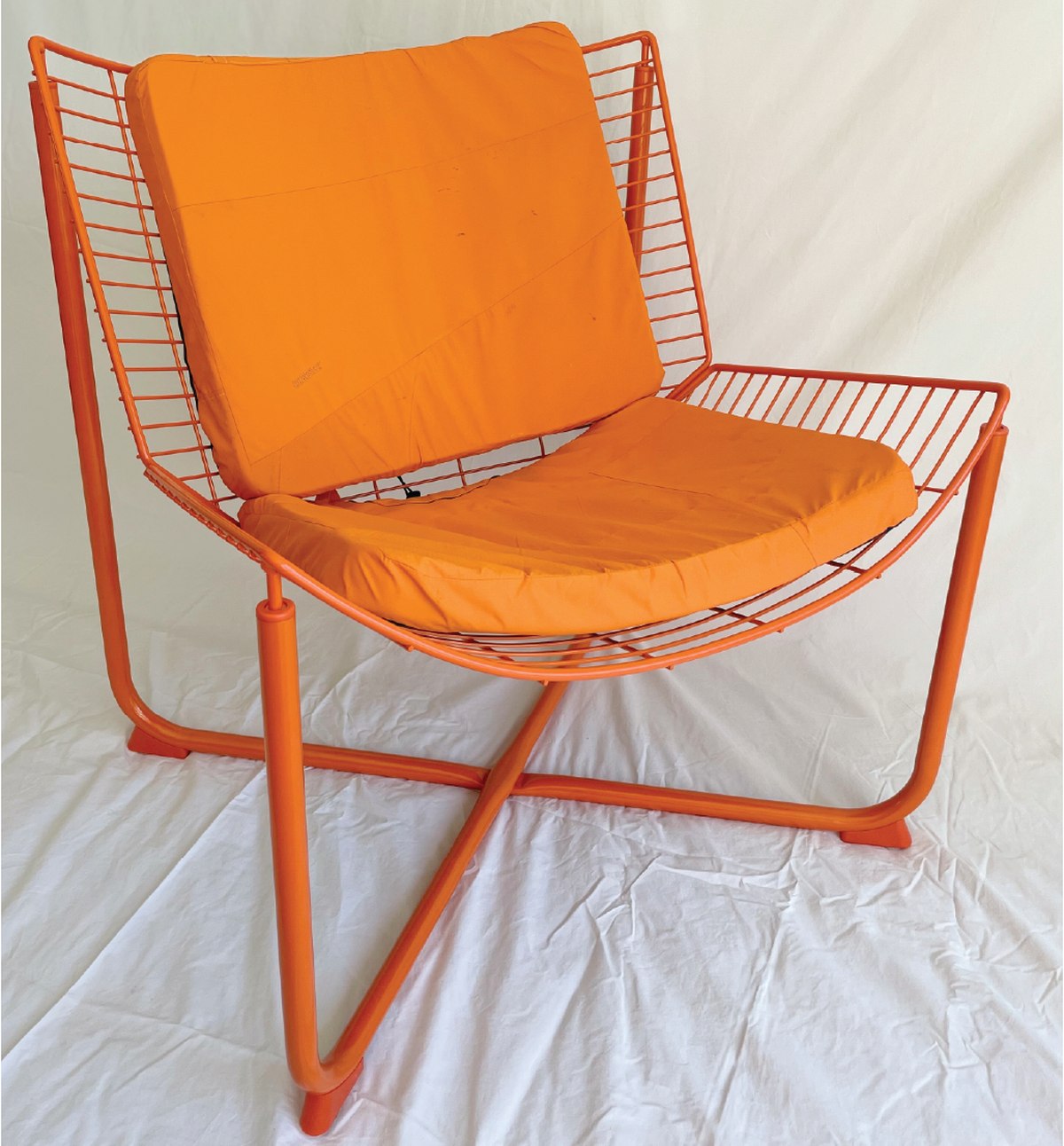 Upcycled Arc'teryx jacket reworked into cushion covers for an Ikea wire chair